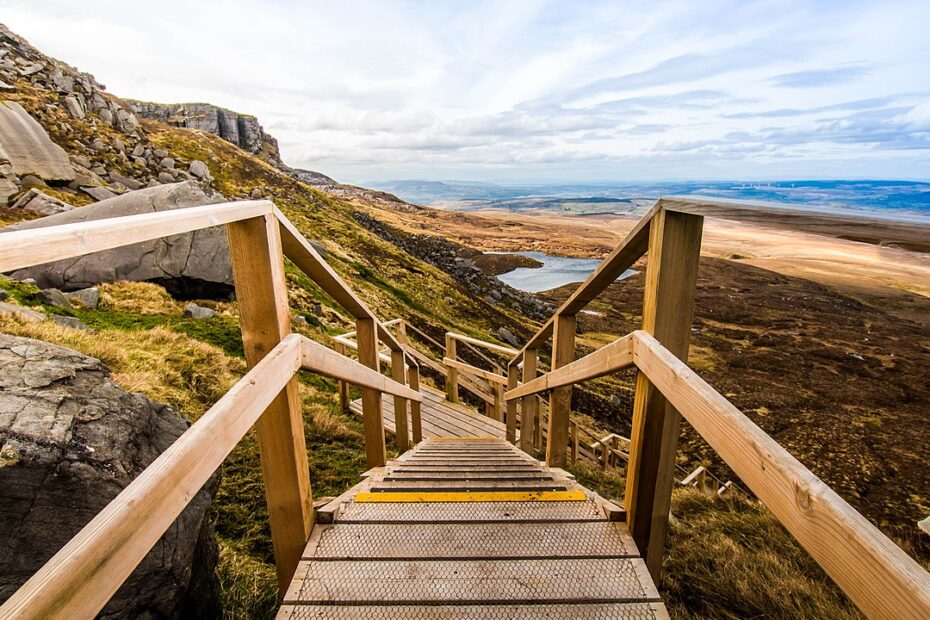 A first person view looking down the 'Stairway to Heaven' Boardwalk in Cuilcagh Mountain, Ireland. Cuilcagh is a mountain on the border between County Fermanagh and County Cavan. The boardwalk is a wooden pathway constructed through the rocky mountainous area.