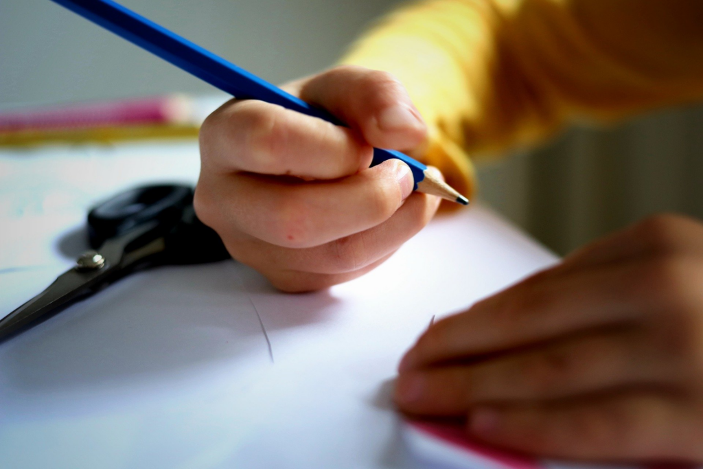 An image of a child writing.