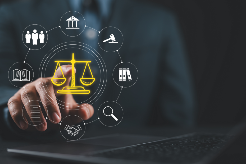 An illustrative image showing a hand pointing to some superimposed symbols, including a drawing of the scales of justice (image: Adobe Stock images)